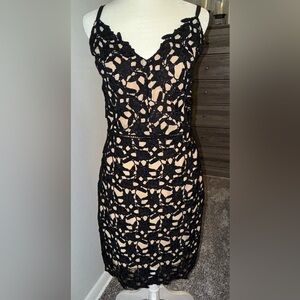 Black,Nude under slip lace dress with gold, metal zipper.